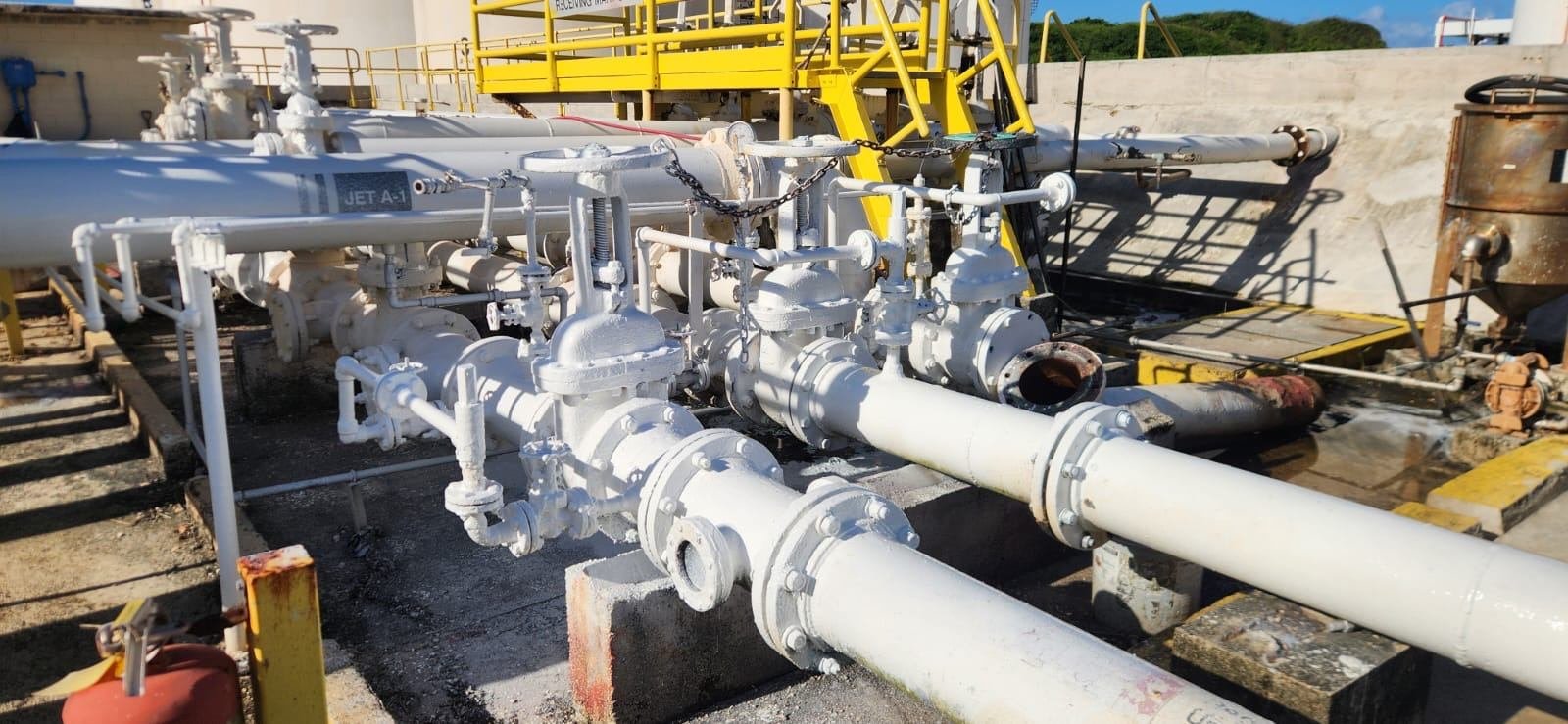 Manifold of fuel pipelines and valves being de-rusted and repainted